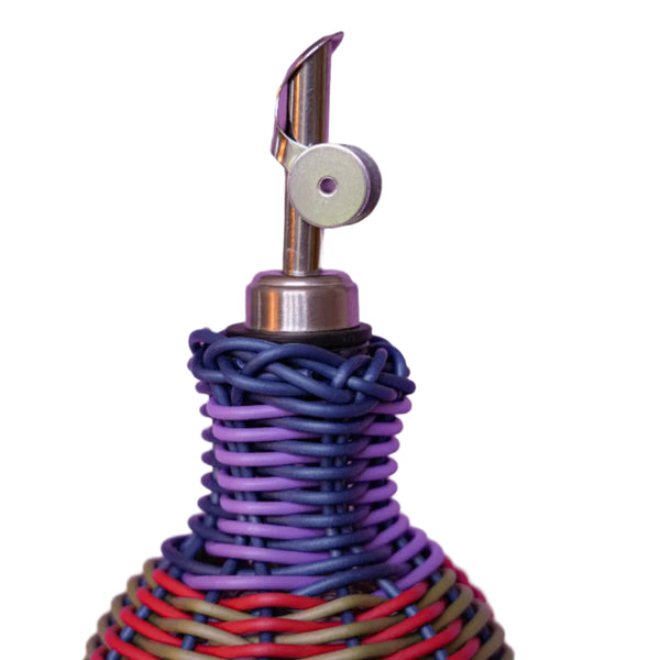 Decorative bottle with woven design and metallic pourer